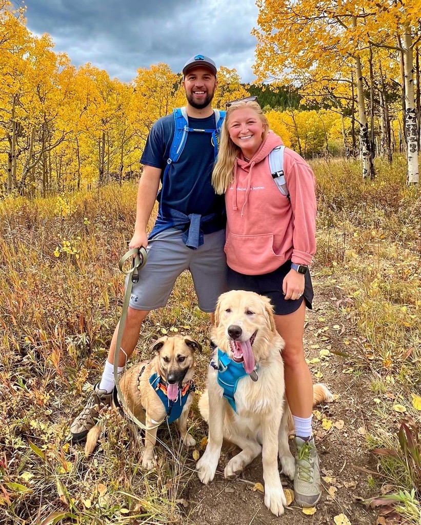 Top Razorback Jordan Johnston with his wife and two dogs.